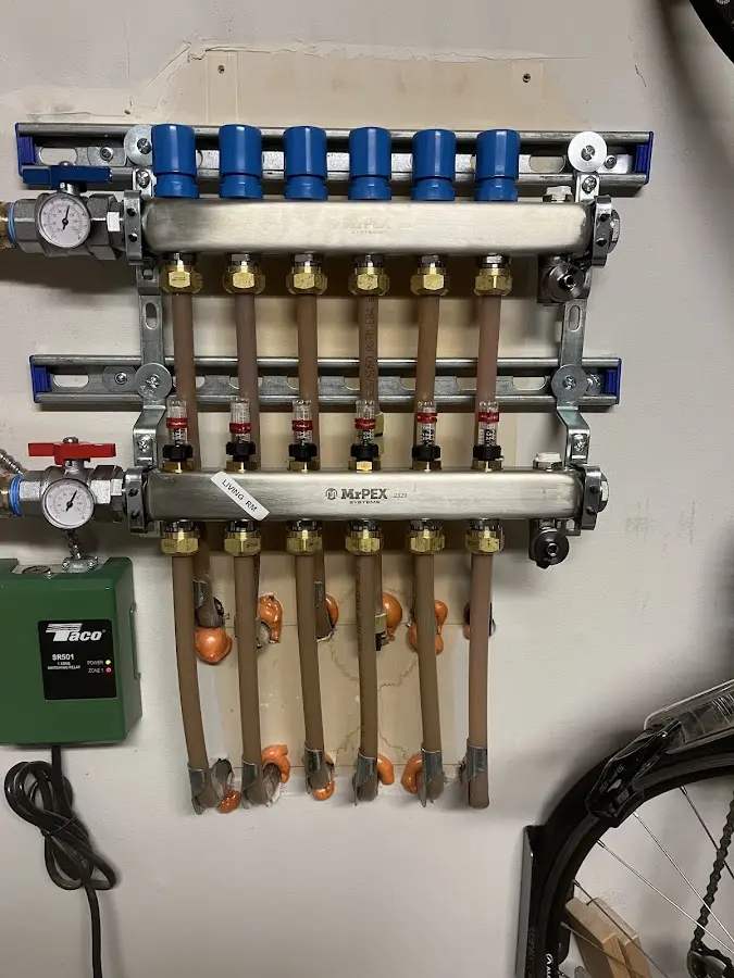 Plumber performing Water Heater Repair at a residential property in Mosinee